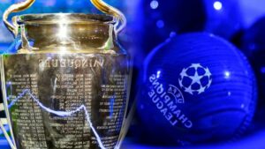 Avrupa kupası ile Galatasaray ve Fenerbahçe arması arka planında UEFA futbol topu logosu